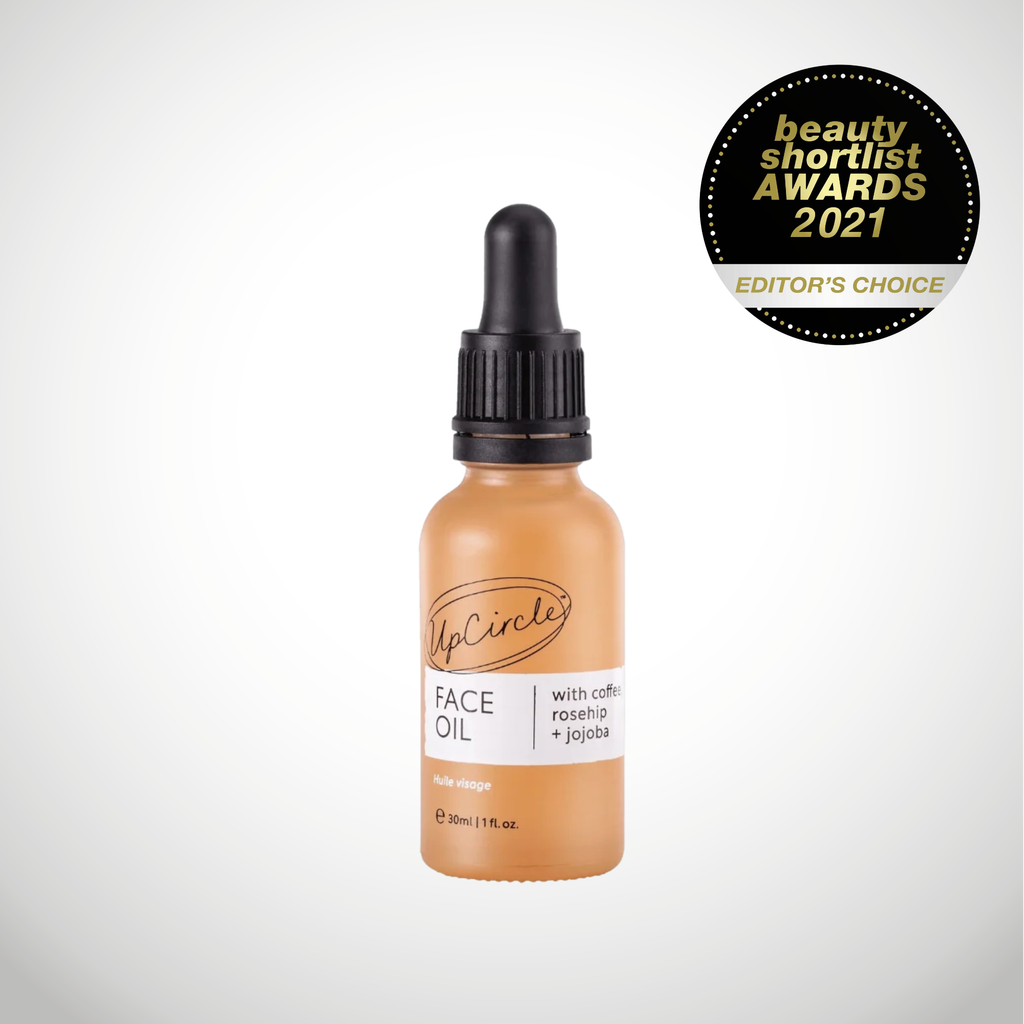 Award winning coffee face oil in brown glass bottle and dropper cap. Cruelty free vegan upcycled ingredients