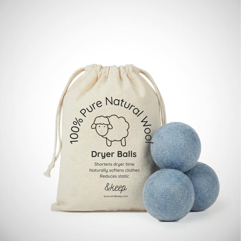 Set of 3 blue wool dryer balls with a cloth bag. Shortens dryer time and naturally softens clothes. Reduces static.